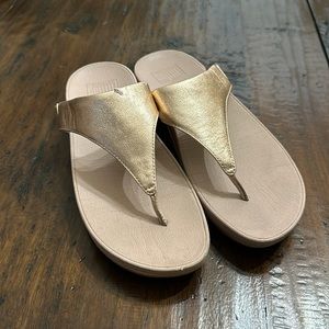 Fitflop rose gold shoes.